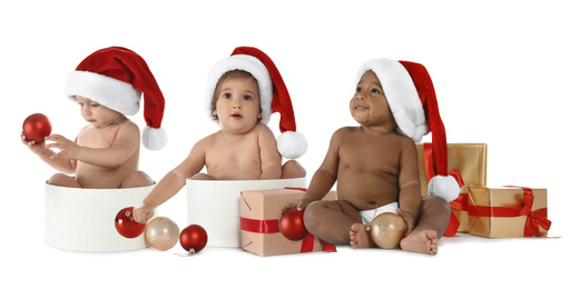 Image of Collage with photos of cute babies wearing Santa hats on white background. Banner design