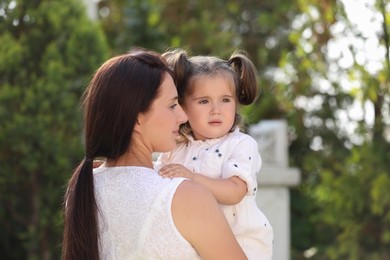 Photo of Portrait of mother with her cute daughter outdoors