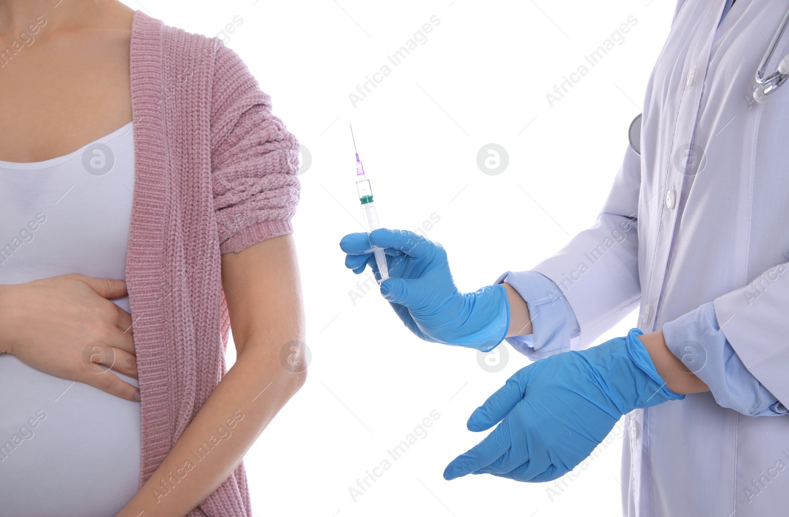 Photo of Doctor giving injection to pregnant woman on white background, closeup. Vaccination concept