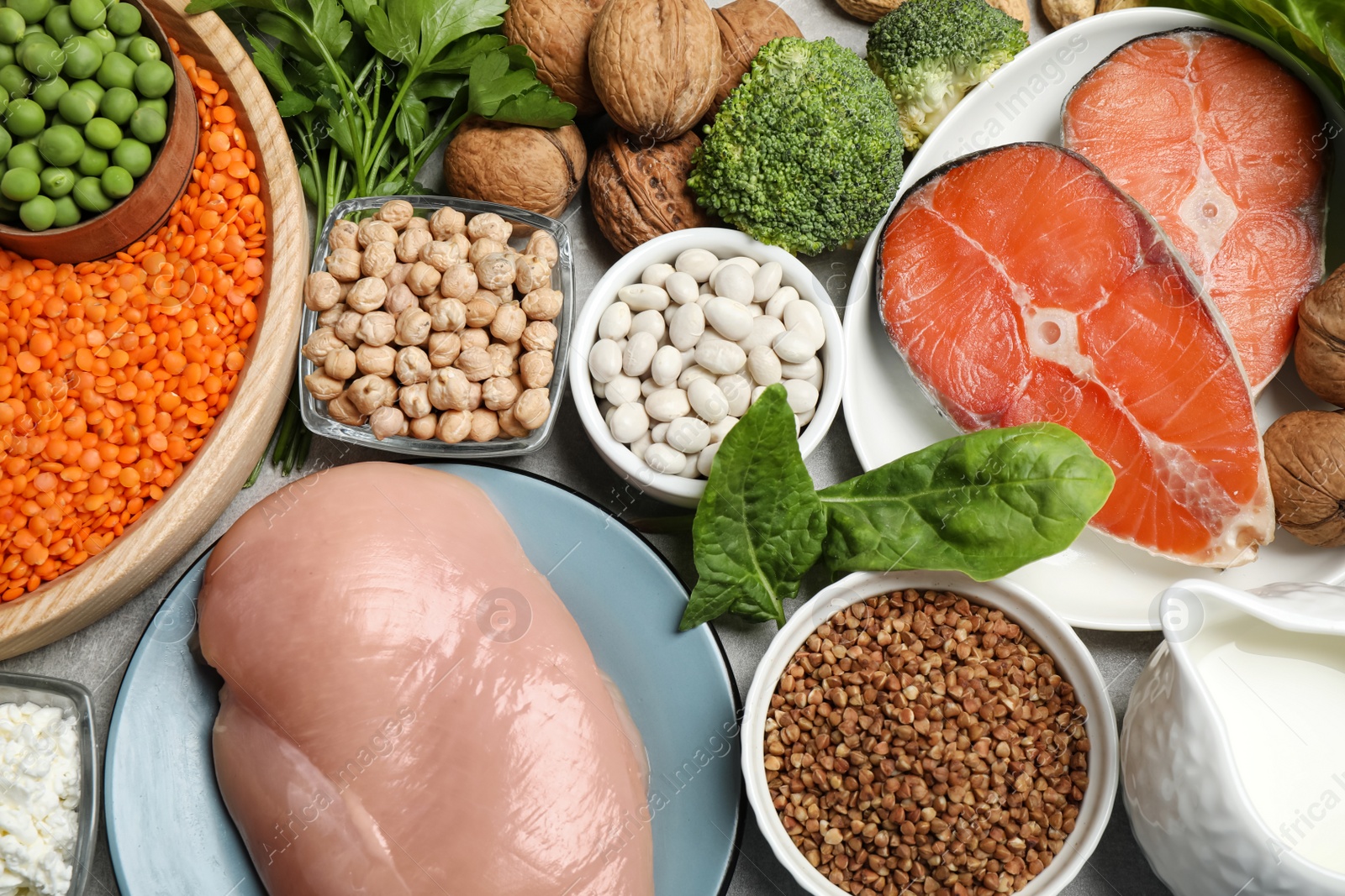 Photo of Different products rich in protein on table, flat lay