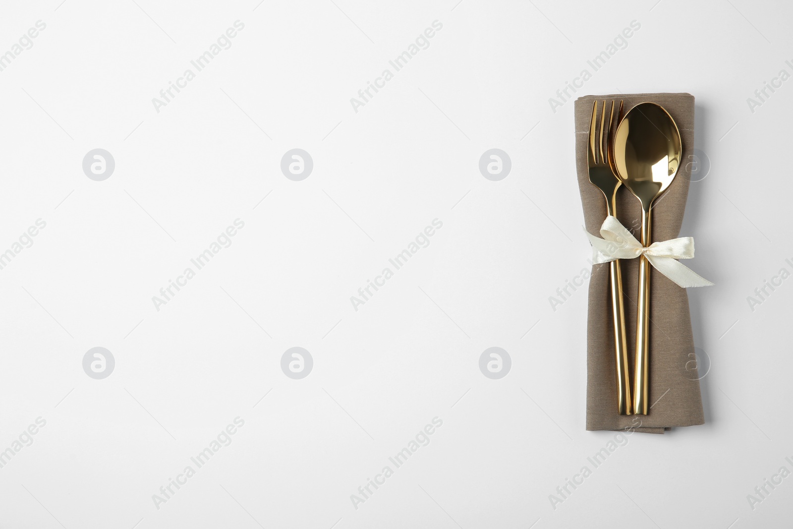 Photo of Cutlery set for festive table on white background, top view