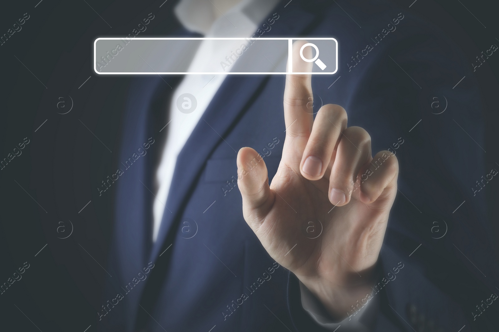 Image of Man pointing at search bar on virtual screen against dark background, closeup
