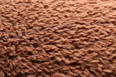 Texture of brown faux fur as background, closeup