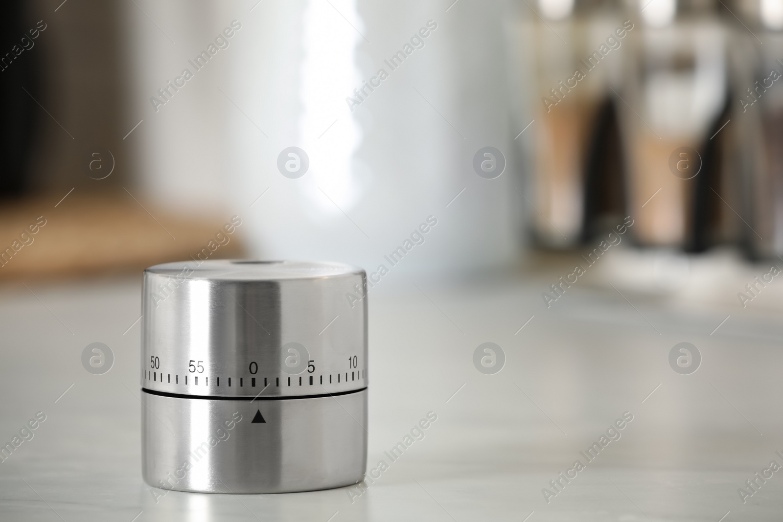 Photo of Kitchen timer on white table indoors. Space for text