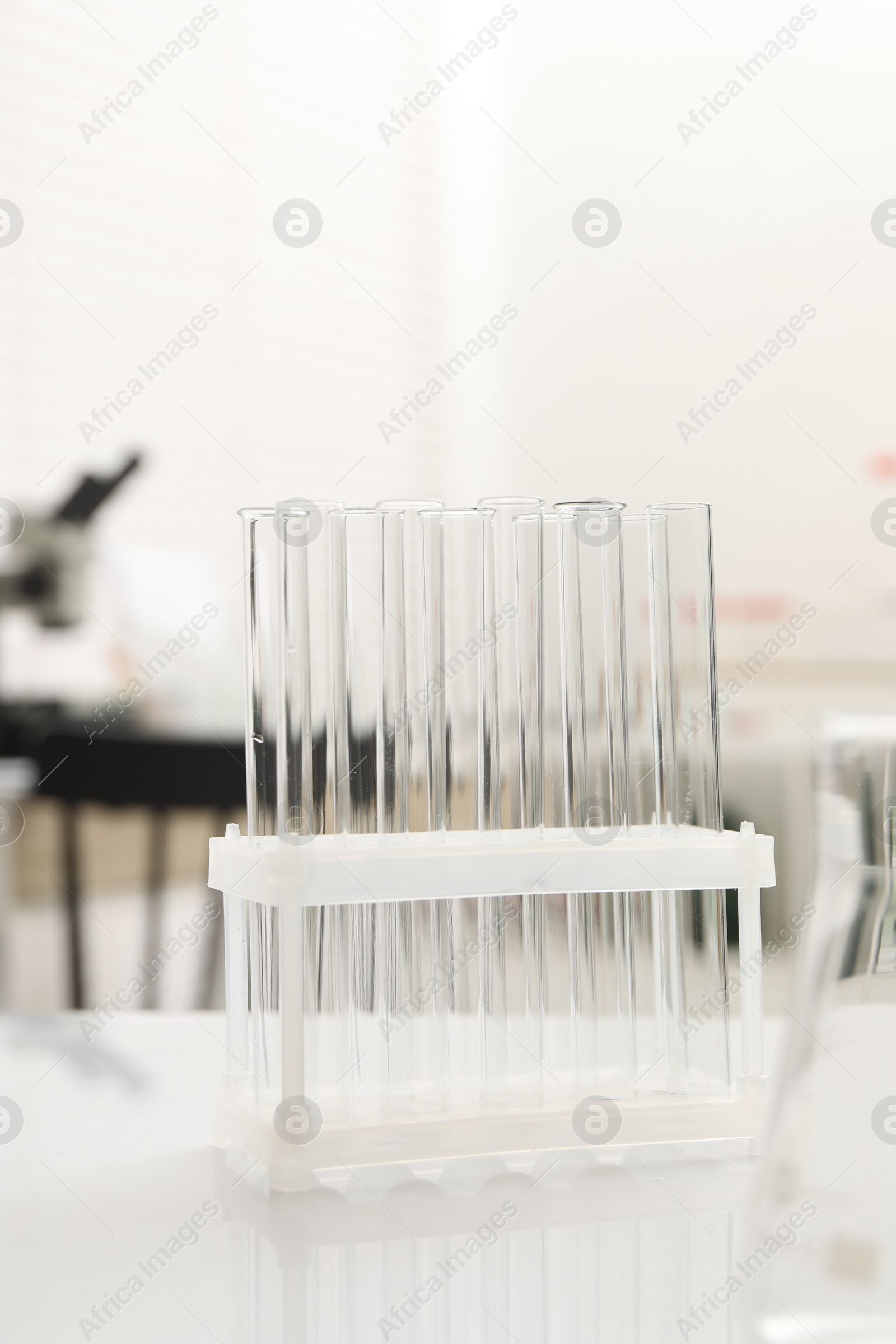 Photo of Laboratory analysis. Many test tubes on white table indoors