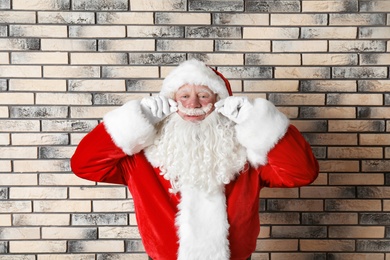 Photo of Authentic Santa Claus on brick wall background