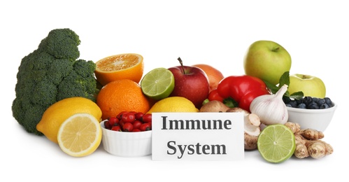 Photo of Set of natural products and card with text Immune System on white background