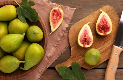 Photo of Cut and whole green figs on wooden table, flat lay