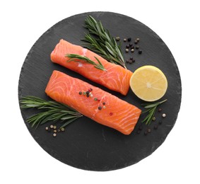 Photo of Pieces of fresh raw salmon, spices and lemon on white background, top view