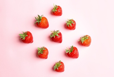 Flat lay composition with with tasty ripe strawberries on color background