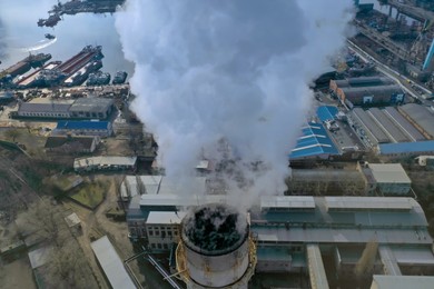 Polluting air with smoke, aerial view of industrial factory. CO2 emissions