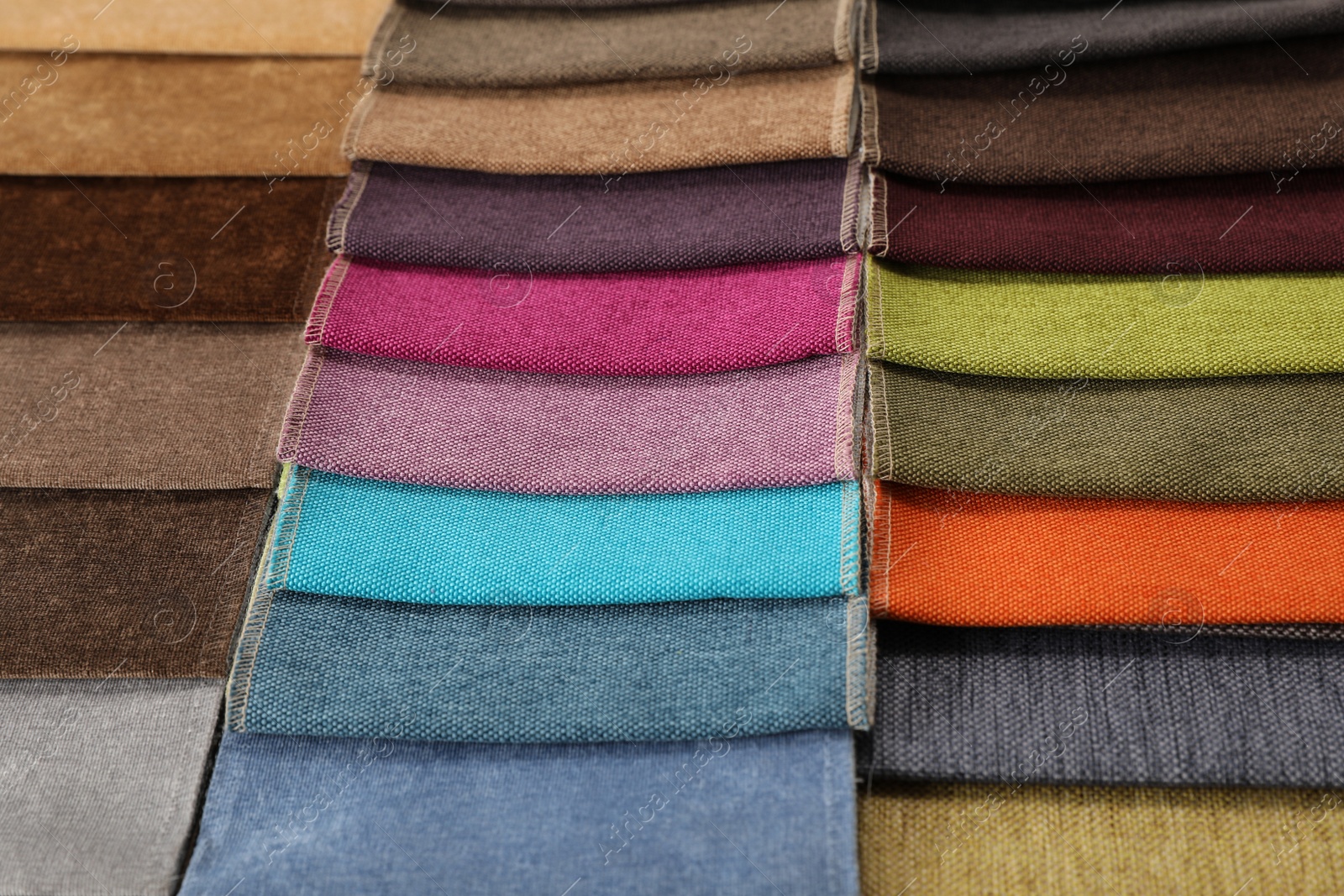 Photo of Fabric samples of different colors as background