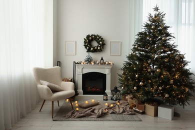 Photo of Cosy room with fireplace decorated for Christmas