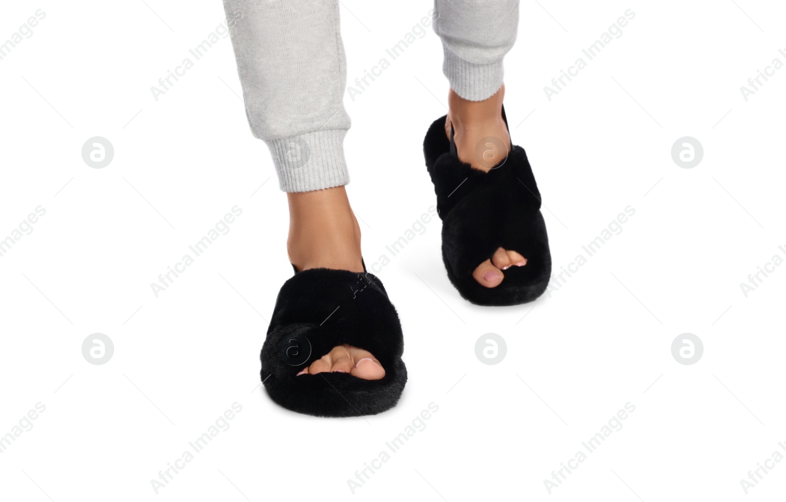 Photo of Woman in fluffy slippers on white background, closeup