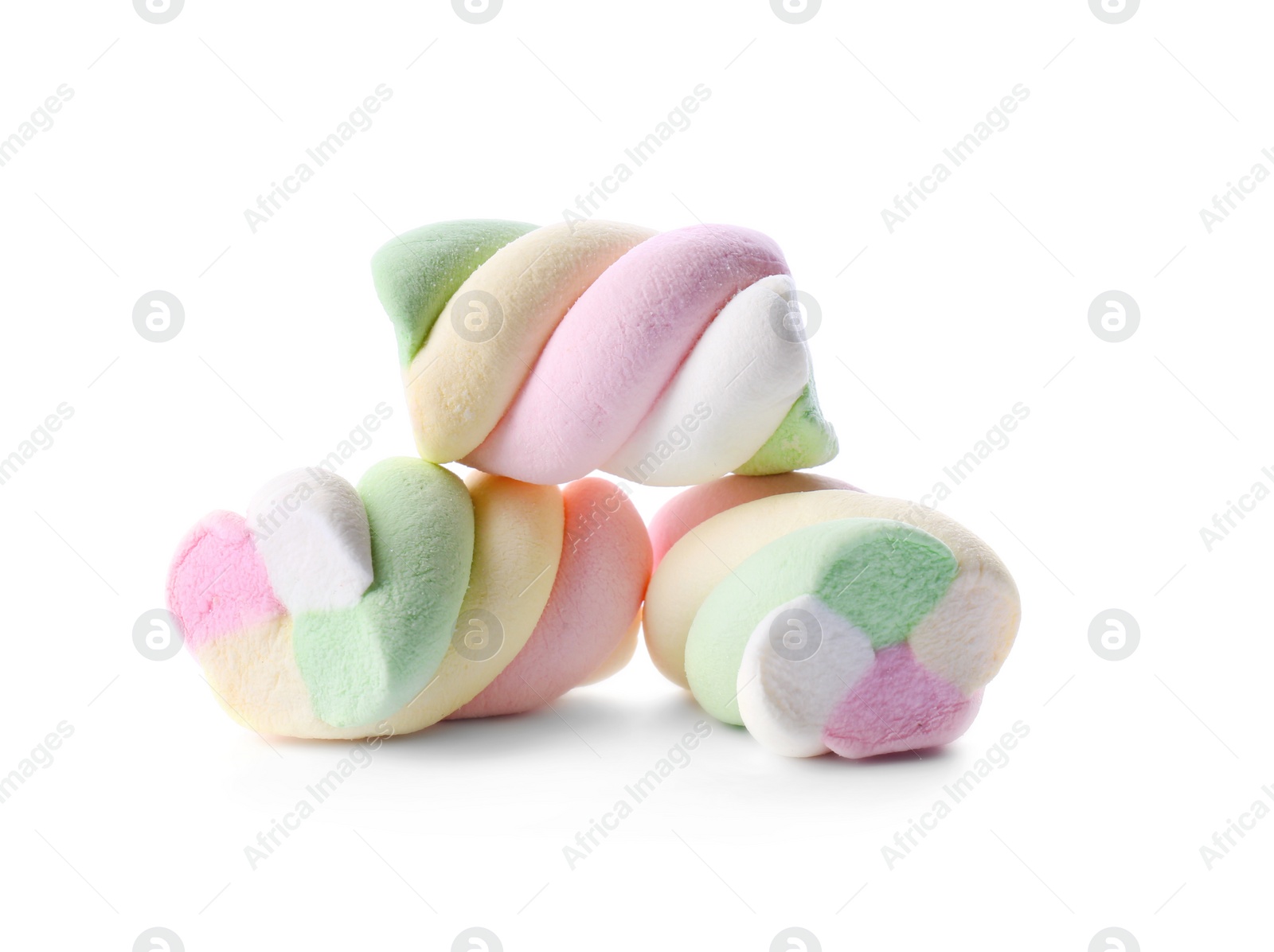 Photo of Three delicious colorful marshmallows on white background