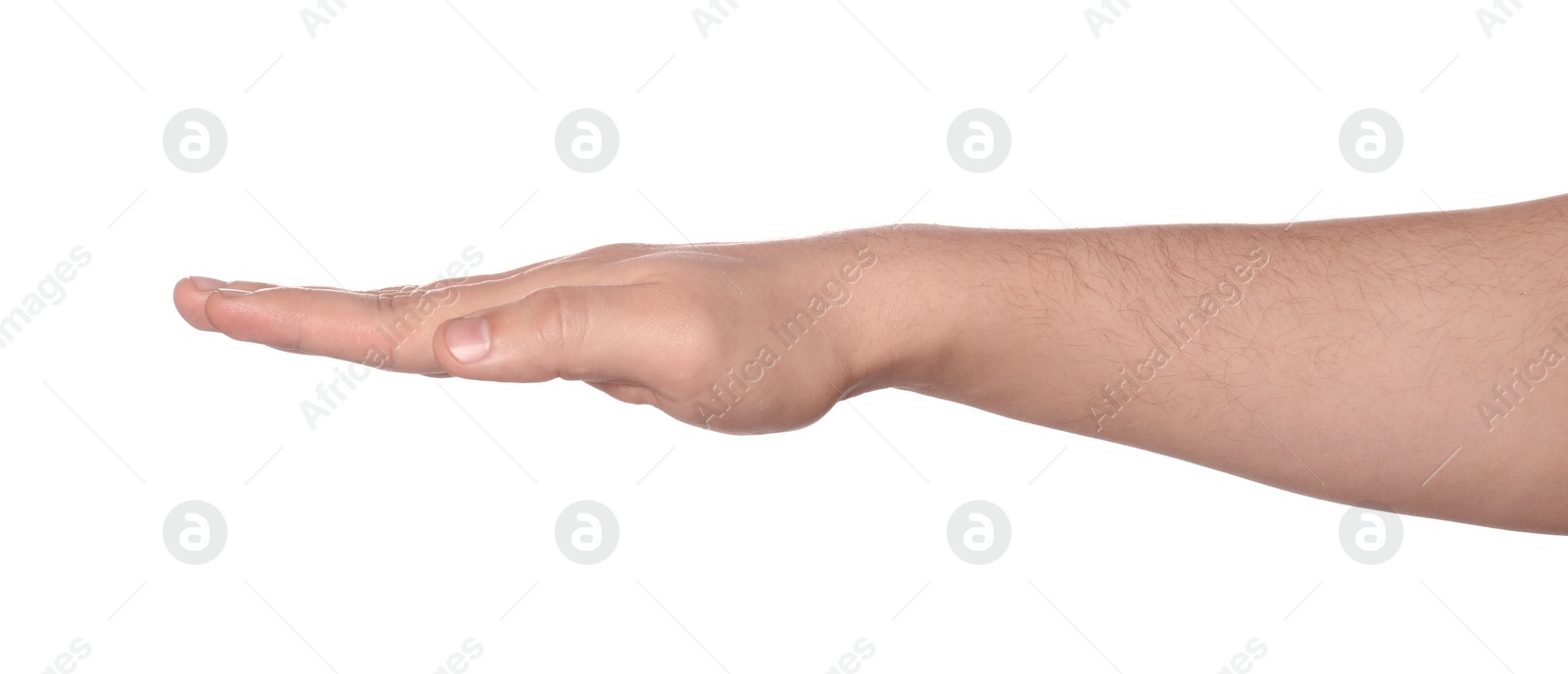 Photo of Playing rock, paper and scissors. Man making paper with his fingers on white background, closeup