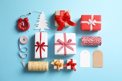 Photo of Flat lay composition with gift boxes on color background, top view