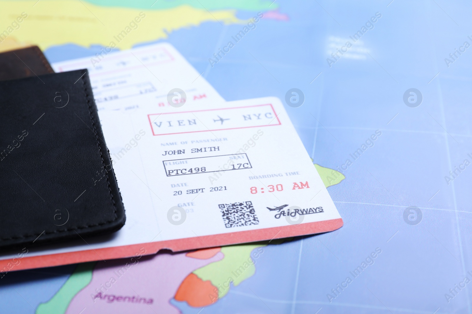 Photo of Passports with tickets on world map, closeup. Travel agency concept