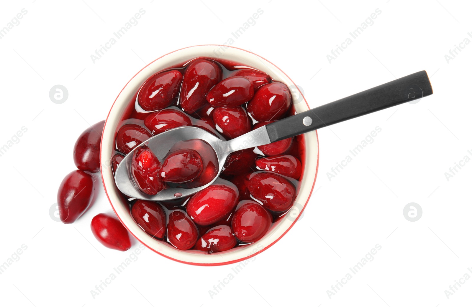Photo of Delicious dogwood jam with berries and spoon on white background, top view