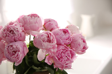 Photo of Bouquet of beautiful fresh pink peonies indoors, closeup