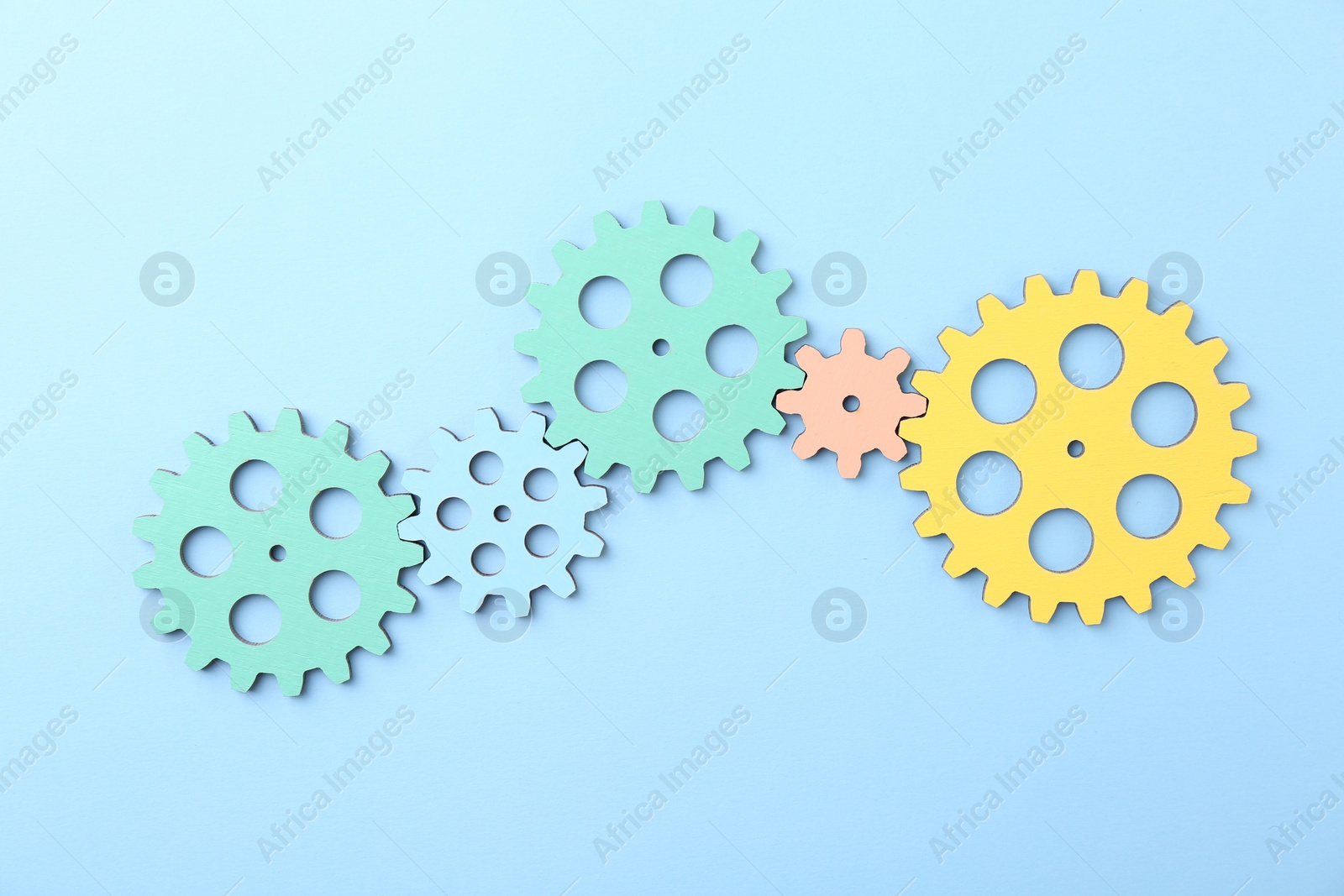 Photo of Business process organization and optimization. Scheme with colorful figures on light blue background, top view