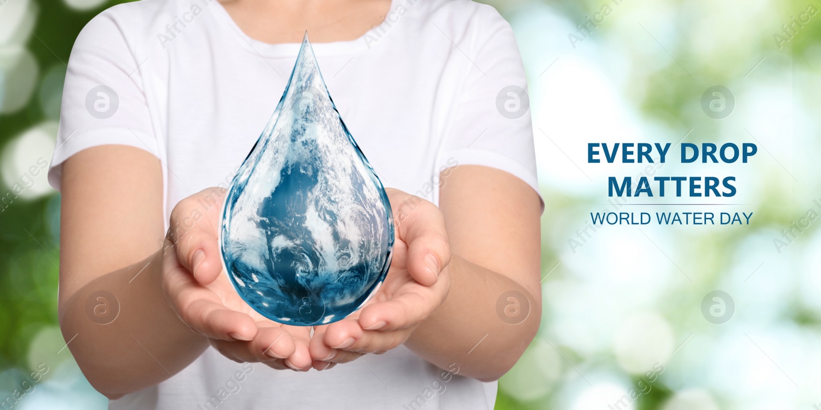 Image of World Water Day. Woman holding icon of drop with Earth image inside on blurred green background, closeup