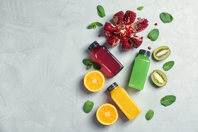 Photo of Flat lay composition with tasty juices and ingredients on light background