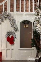 Photo of Christmas garland and festive decor indoors. Interior design