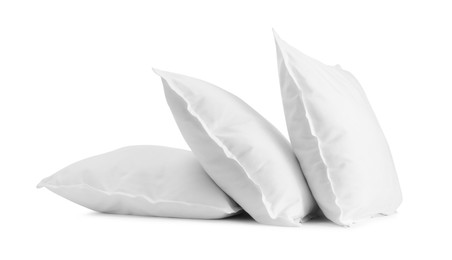 Photo of Three new soft pillows isolated on white