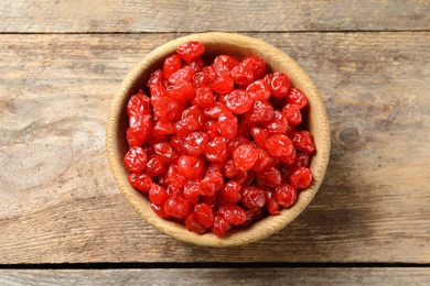 Photo of Bowl of sweet cherries on table, top view. Dried fruit as healthy snack