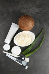 Flat lay composition with homemade cosmetic products and fresh ingredients on black table