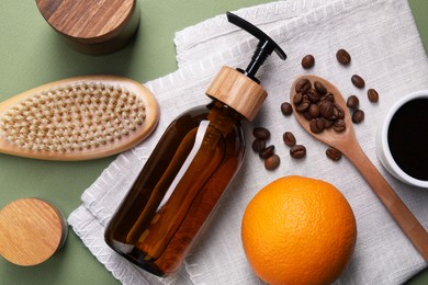 Photo of Flat lay composition with cosmetic products and fresh ingredients on olive background. Anti cellulite treatment