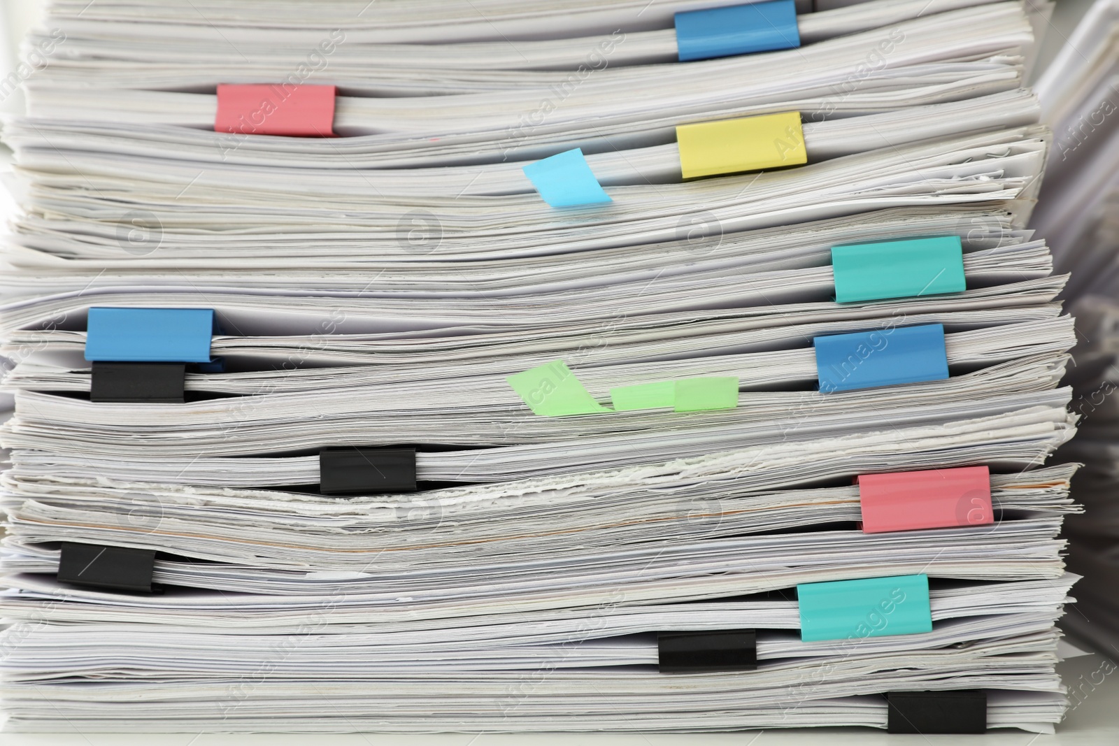 Photo of Stack of documents with paper clips, closeup