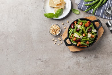 Photo of Delicious salad with green beans, mushrooms and cheese on light grey table, flat lay. Space for text