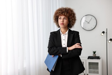 Beautiful female notary with clipboard in office