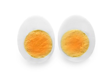 Photo of Halves of fresh hard boiled egg on white background, top view