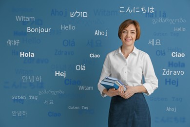 Image of Portrait of happy translator and greeting words in different foreign languages on light blue background