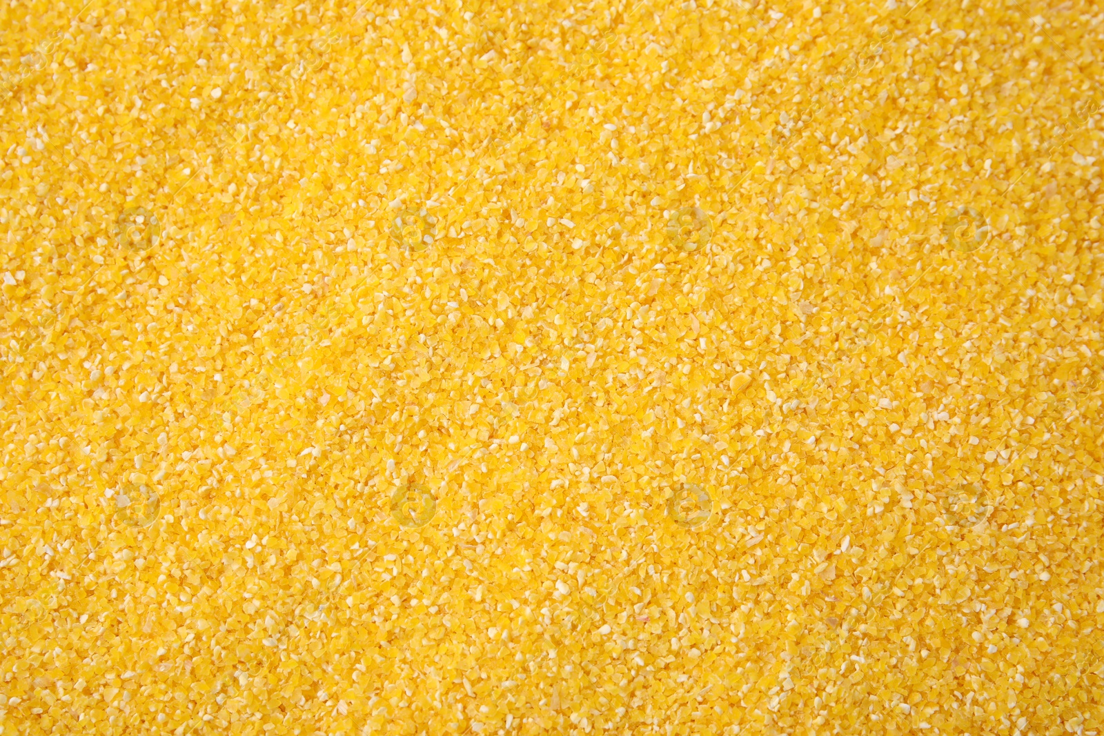 Photo of Raw corn grits as background, top view