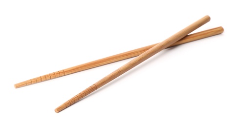 Photo of Chopsticks made of bamboo on white background