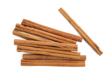 Photo of Aromatic dry cinnamon sticks on white background, top view