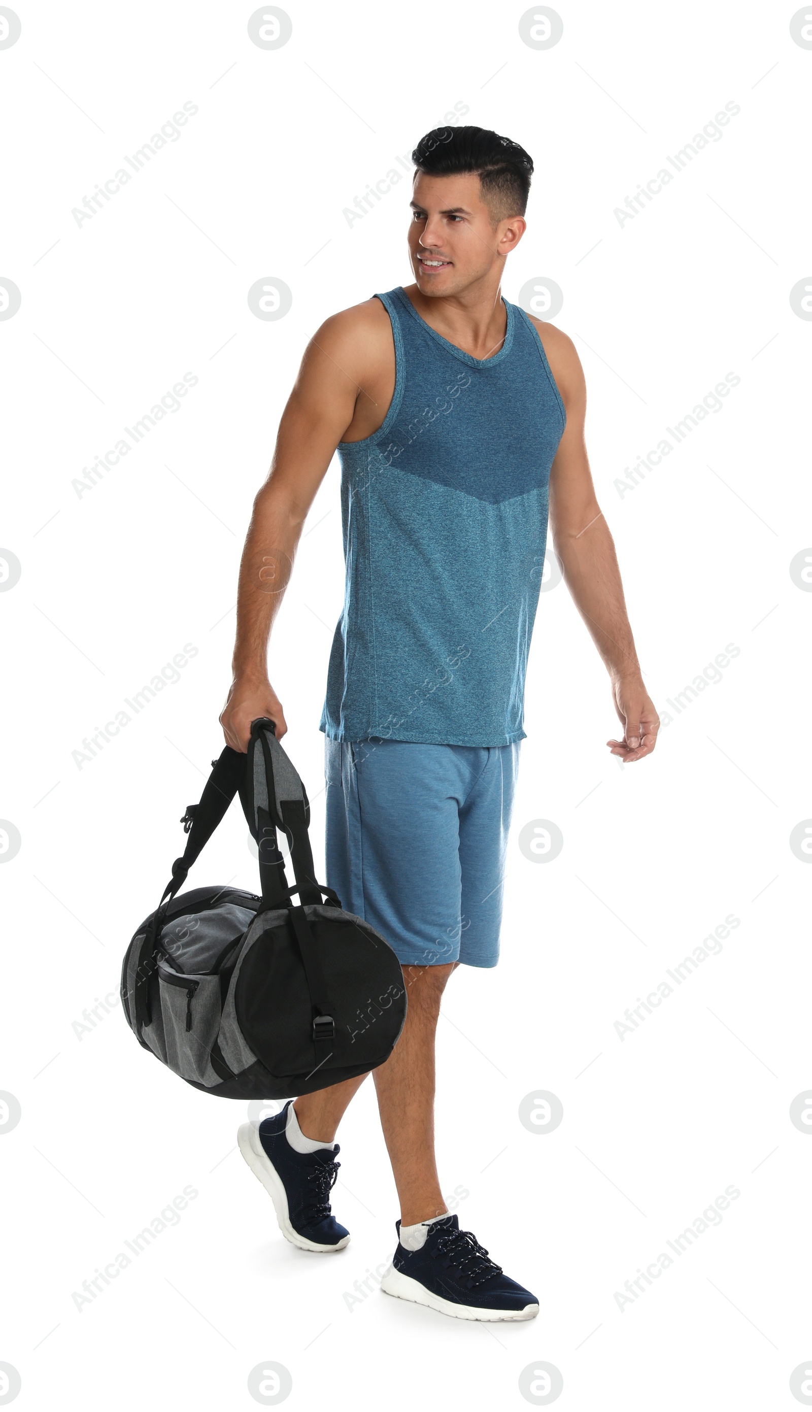 Photo of Handsome man with sports bag on white background