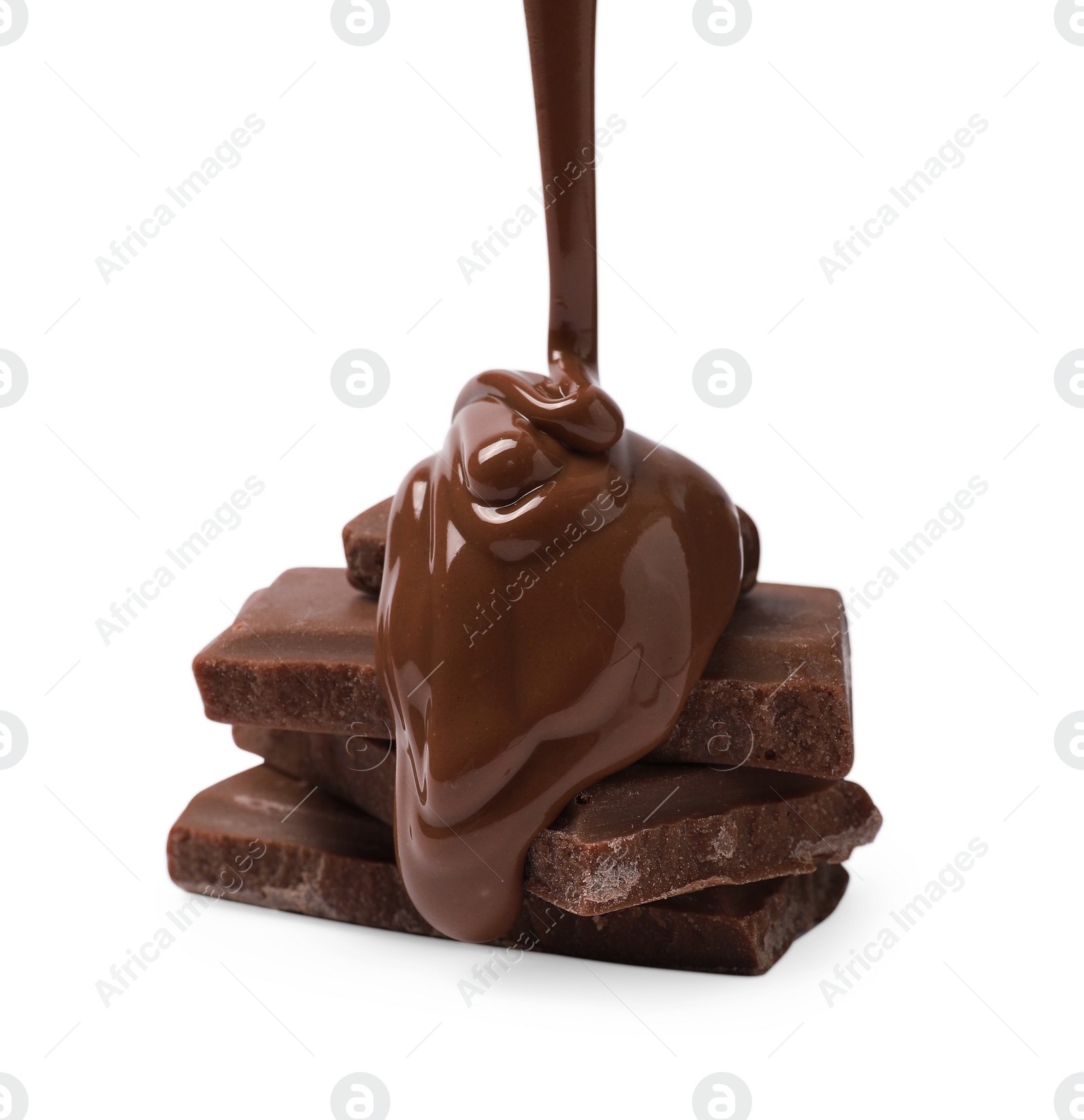 Photo of Pouring tasty milk chocolate paste onto pieces isolated on white