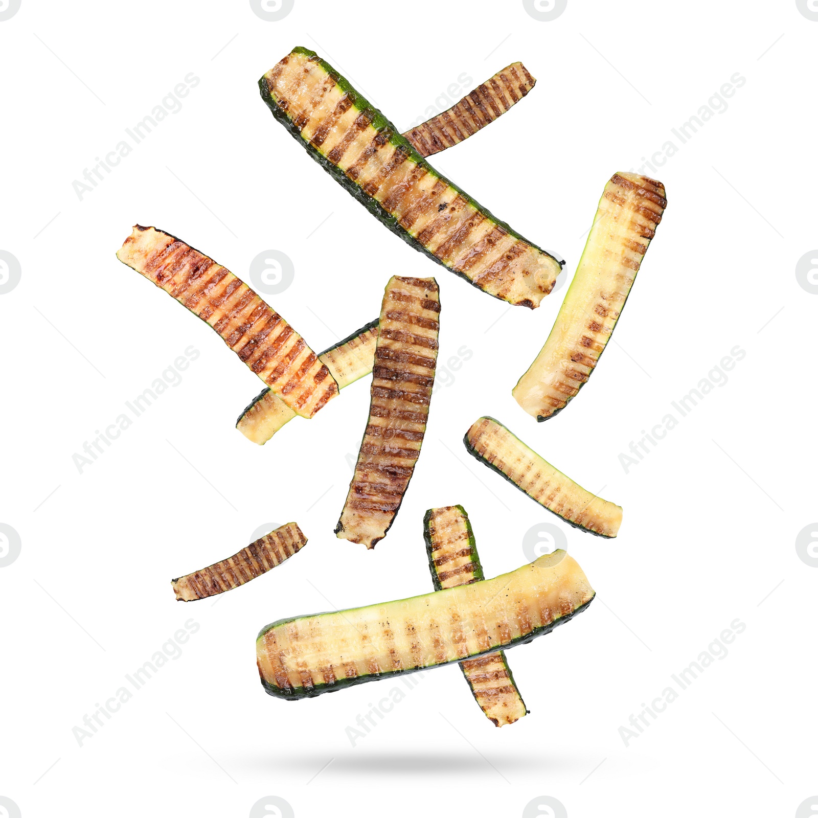 Image of Slices of grilled zucchinis in air on white background