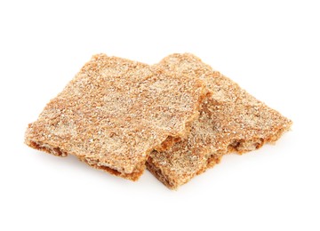 Photo of Pieces of crunchy rye crispbread on white background
