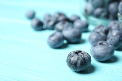 Photo of Juicy and fresh blueberries on wooden table, closeup