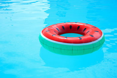 Photo of Inflatable ring in swimming pool on sunny day