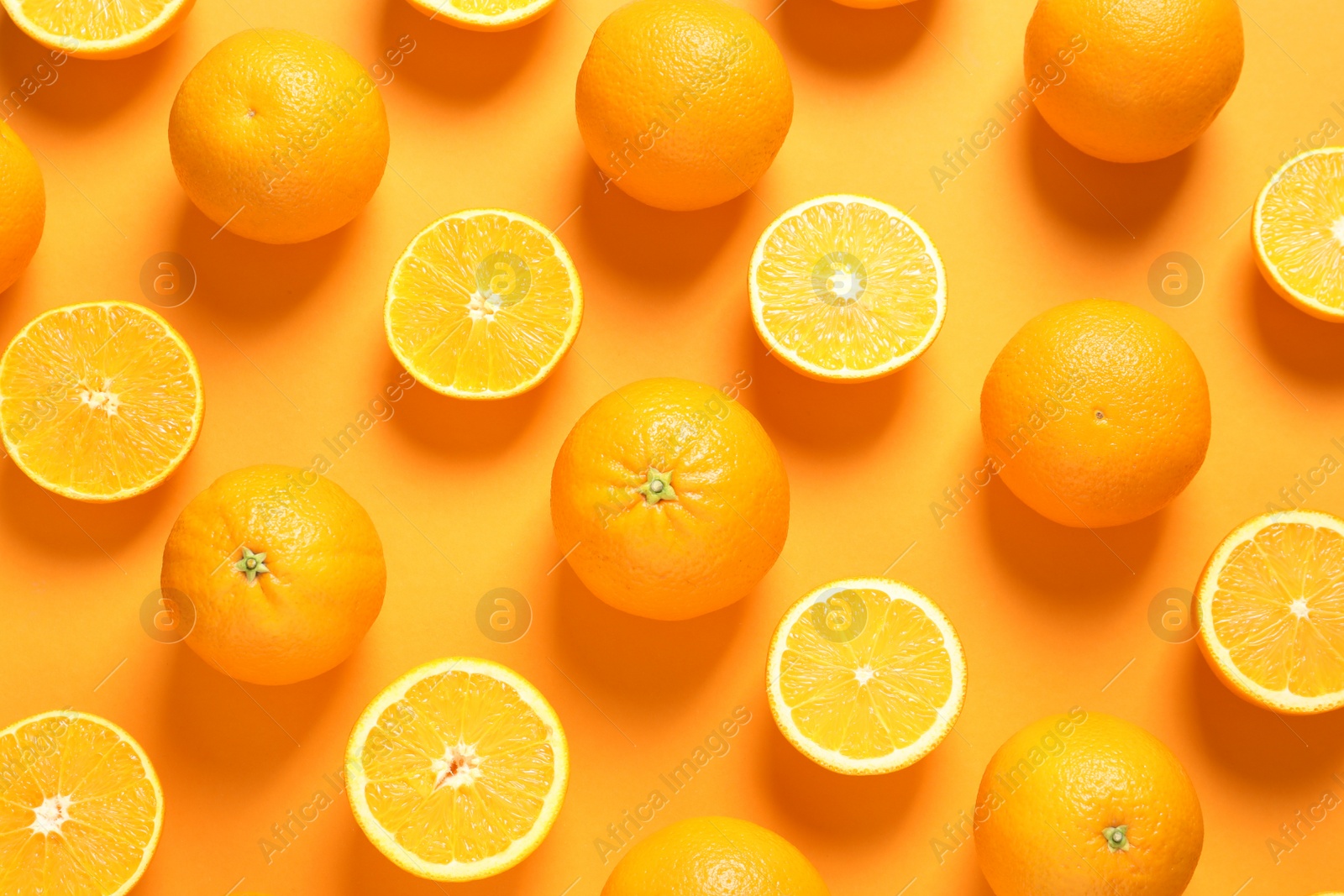 Photo of Flat lay composition with ripe oranges on color background