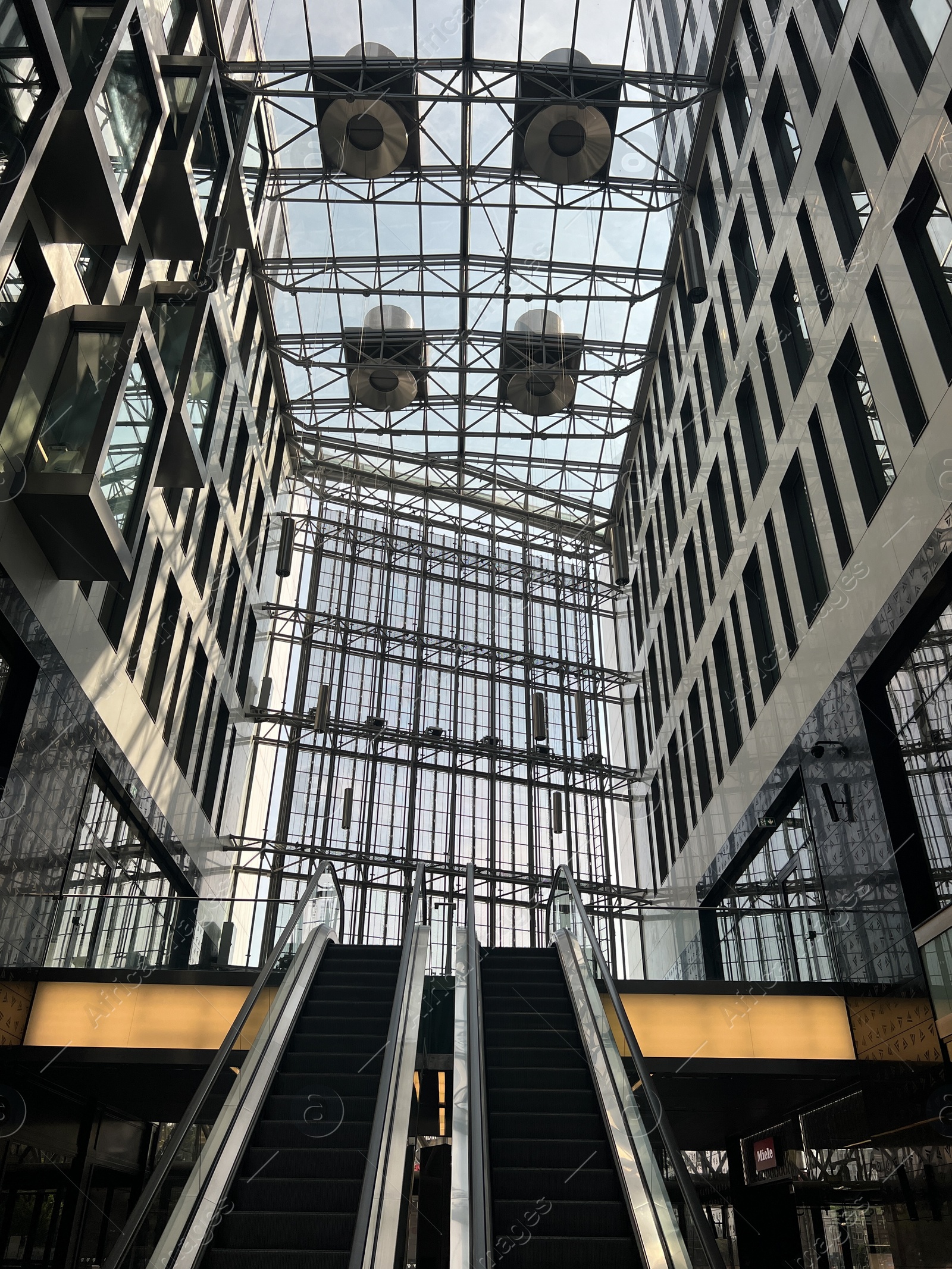 Photo of WARSAW, POLAND - JULY 23, 2022: Modern escalators in shopping mall