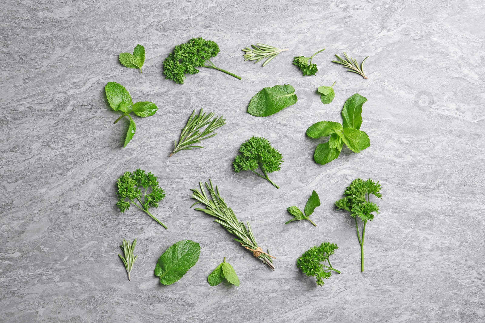 Photo of Flat lay composition with rosemary on table. Aromatic herbs