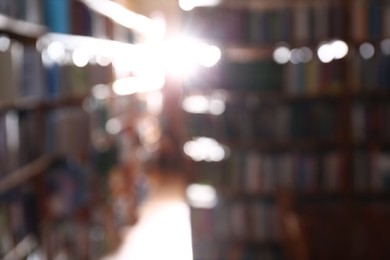 Blurred view of different books on shelves in library